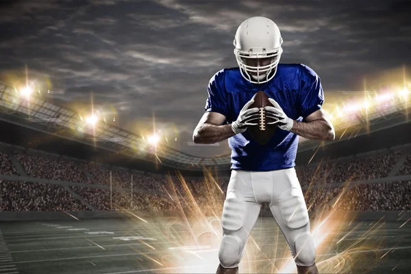 depositphotos_94961266-stock-photo-football-player-on-a-stadium